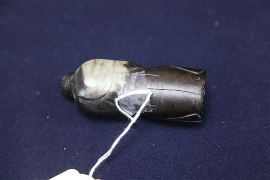 A Chinese white and black jade figure of a sage, possibly Han dynasty, height 9.1cm, wood stand